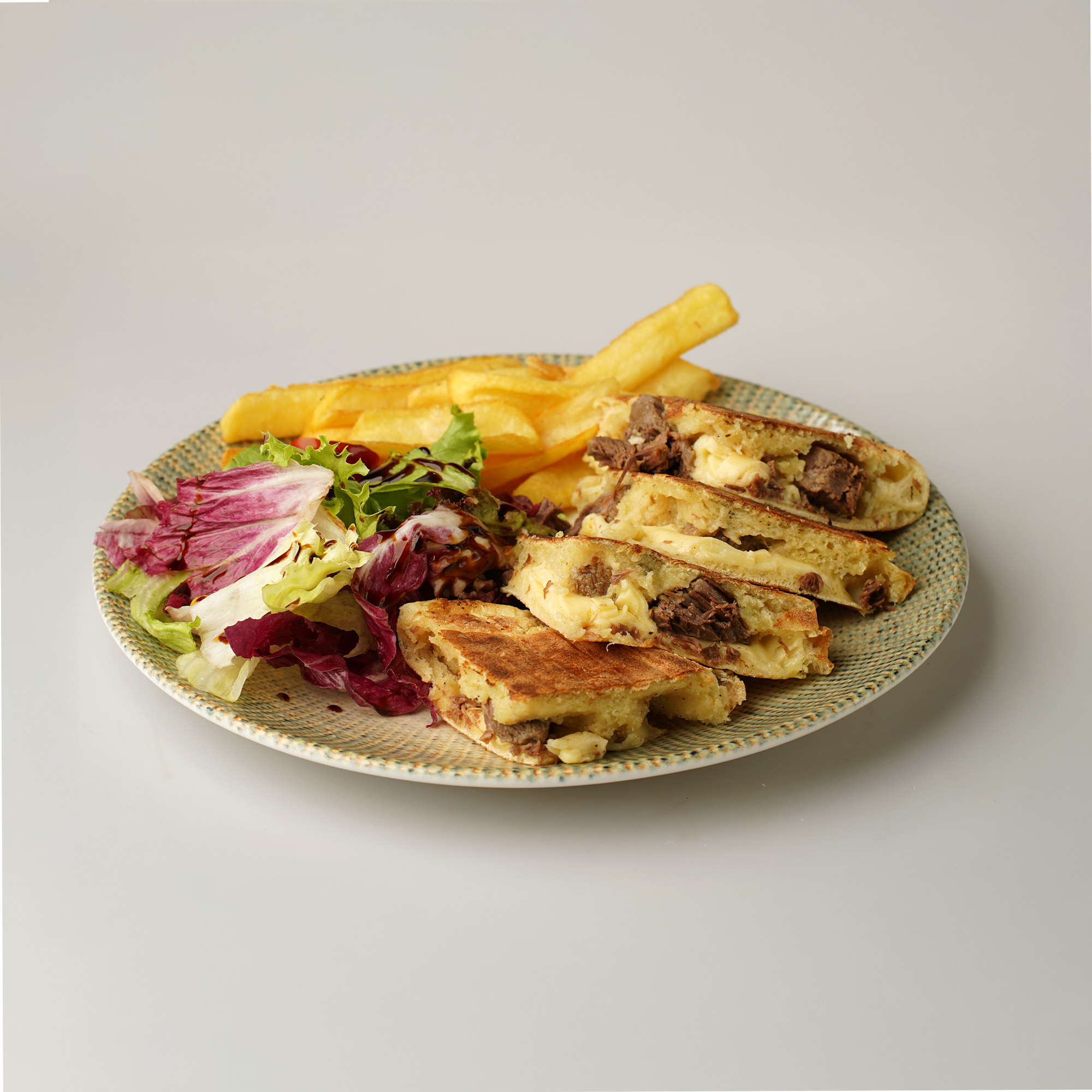 Bazlama with kavurma and kaşar cheese